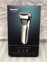 Front view of KENSEN Series S11 Electric Foil Shaver box showing product image, brand, and key features including waterproof, replaceable blade, and pop-up trimmer.