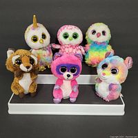 Photo showing the 6 assorted Beanie Boos plush toys, no hang tags, arranged on display. Various animal characters in colorful plush fabric with large shiny eyes.