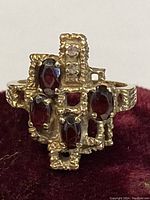 Front view of ring showing garnet and diamond arrangements.