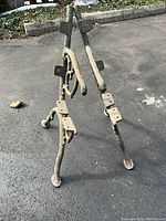 Pair of bench supports shown front-on with mounting plates visible