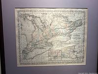 Frontal view of the framed map showing decorative border and overall condition