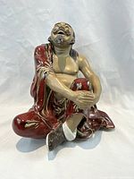 Front-quarter view showing seated posture and overall form