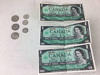 Full lot including three 1967 Canadian Centennial one-dollar bills and six silver coins (3 dimes, 3 quarters). Bills show crease; coins appear worn.
