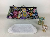 Lot with all items visible: black beaded embroidered purse, white beaded clutch, two turquoise and gold decorative jewelry boxes shaped like vintage telephones.