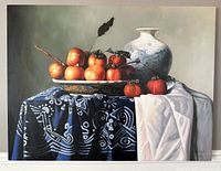 Full frontal view of the painting showing persimmons on a dish, porcelain vase, and draped cloth