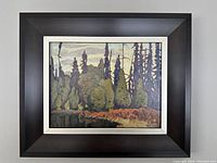 Full view of the framed textured painting/print representing Lawren Harris's "Sand Lake Algoma" in dark hardwood frame as offered.