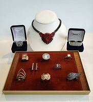 Full lot photo showing all jewellery including necklace and rings, some in boxes