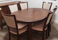 Full set view showing wooden table and six chairs