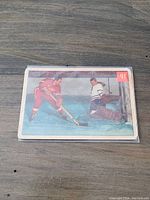 Front of 1954-55 Parkhurst Battle of the All Stars hockey card featuring Red Kelly vs Lumley in action with card number 91.