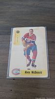 Front of 1958-59 Parkhurst hockey card showing Alvin McDonald in Canadiens uniform with card number 30 and position LW WING.