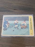 Front side of the 1958-59 Parkhurst Armstrong hockey card numbered 7 in a protective sleeve showing color artwork and text.