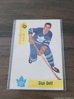 Front of 1958-59 Parkhurst Dick Duff hockey card showing player image in Toronto Maple Leafs uniform, card number, position and team logo