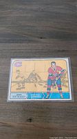 Front side of the vintage 1968-69 O-Pee-Chee Henri Richard hockey card numbered 165. Shows Henri Richard in Montreal Canadiens uniform with a yellow background and small player images.
