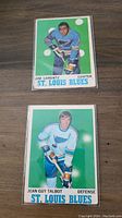 Front of Jim Lorentz and Jean Guy Talbot 1970 OPC St. Louis Blues hockey cards showing player images and team details.