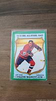 Front of the 1973 OPC Frank Mahovlich hockey card showing player image and series info