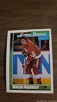 Front side of the Sergei Fedorov Super Rookie hockey card showing the player in red uniform on ice.