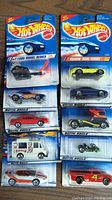 Photo shows 10 unopened Hot Wheels cars in original blister card packaging, various series.
