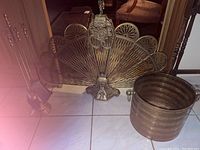 Group shot showing brass fireplace screen, tool set and bucket