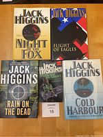 Photo showing all six Jack Higgins books including the five hardcover novels and one softcover edition.