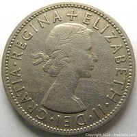 Obverse side of the 1956 two shillings coin showing Queen Elizabeth II profile and surrounding text.