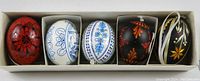 Box containing 5 decorative Easter eggs with different colors and patterns