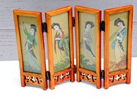 Front view showing four wooden panels with painted Asian Geisha girls.