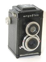 Front angled view of the Argus Argoflex twin lens reflex camera showing the twin lenses and textured body.