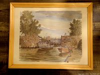 Full view of framed etching depicting canal lock scene with boats, greenery, and stone walls.