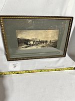 Framed sepia etching showing the entire artwork and frame with measuring tape for scale