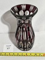 Front view of vintage Nachtmann crystal vase showing violet overlay and cut crystal design with measuring tape for size reference