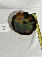 Full view of the vintage Seetusee Mayfair enameled art bowl dish showing scalloped edges and marbled multi-color finish, placed next to a measuring tape showing approximately 10 inches diameter.