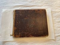 Front cover of the 1911 University of Toronto yearbook showing worn brown textured cover with loose binding.