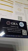 GRA certificate of authenticity card for the moissanite stone with warranty ID visible.