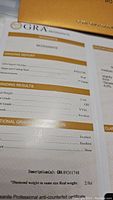 GRA Moissanite grading report showing weight, shape, measurements, color and clarity grades.