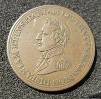 Obverse side of the 1812 Wellington half penny token with portrait and Latin inscription.