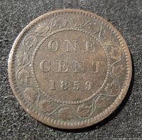 Obverse side of 1859 Large Canada One Cent coin showing denomination and date with vine wreath