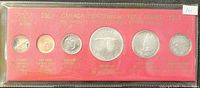 Front view of the 1867-1967 Canadian Centennial coin set in original red packaging with gold text and coins visible through windows.