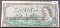 Front view of 1954 Bank of Canada one dollar note showing Queen Elizabeth II portrait and serial number 8777730 in red.