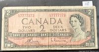 Front of the 1954 Canadian 2 Dollar banknote showing serial number 7777373 and Queen Elizabeth II portrait.