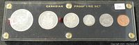 Front view of six coins in clear case showing complete 1964 Canadian Proof Like Set