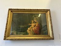 Front view of gilt wood framed print showing Mary and infant Jesus at sea