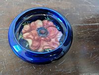 Top view of bowl showing pink anemone design and cobalt blue glaze