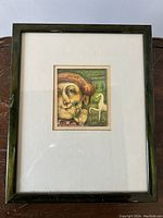 Front view of the framed artwork showing full composition in white mat and black frame