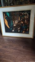 Framed abstract lithograph artwork by Simon Shegelman, full front view showing frame, mat, and artwork with swirling organic patterns in teal and brown hues.