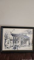 Full frontal view of framed vintage watercolor artwork showing the entire scene in black and white depicting a Toronto street and vintage building with pedestrians and vehicles.