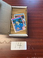 Archive box open showing stacked hockey cards and two cards on top (Peter Stastny, Butch Goring)