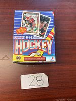 Closed box of 1991-92 Score hockey cards with colorful design featuring players and card images.