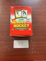Closed red and white box of 1991 Score NHL Series 1 hockey cards with front label visible.