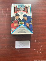 Closed box of 1991-1992 Upper Deck NHL Hockey cards with colorful player illustrations on the front
