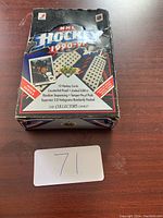 Front view of the 1990-91 Upper Deck NHL hockey card box showing branding and wrapper details.